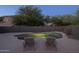 Backyard pool with lush trees, seating, and privacy fencing create a serene escape at 2661 E Los Alamos Ct, Gilbert, AZ 85295