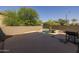 A refreshing pool with desert landscaping surrounds the backyard, offering a perfect spot for outdoor enjoyment at 2661 E Los Alamos Ct, Gilbert, AZ 85295