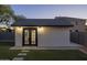 Backyard shed with double doors and lighting, adding charm and functionality at 2661 E Los Alamos Ct, Gilbert, AZ 85295