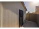 Exterior view of the shed with black door and concrete pad at 2661 E Los Alamos Ct, Gilbert, AZ 85295