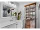 Bright bathroom with white vanity, modern lighting, large mirror, and natural light at 2804 N Nebraska St, Chandler, AZ 85225