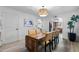 Bright dining room features a stylish light fixture and seats six comfortably at 2804 N Nebraska St, Chandler, AZ 85225