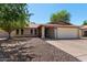 Charming brick home with a well-maintained yard, covered porch, and two-car garage at 2804 N Nebraska St, Chandler, AZ 85225