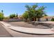 Well-kept front yard with rock landscaping and mature trees, enhancing curb appeal at 2804 N Nebraska St, Chandler, AZ 85225