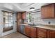 Classic kitchen showcasing warm cabinetry and direct access to the backyard at 2804 N Nebraska St, Chandler, AZ 85225