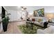 Comfortable living room showcasing modern decor, a stylish rug, and ample natural light with a ceiling fan at 2804 N Nebraska St, Chandler, AZ 85225