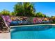 Unique pool design showcases a rock waterfall feature and artistic mural backdrop at 2804 N Nebraska St, Chandler, AZ 85225