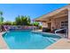 Backyard pool has an outdoor living space and waterfall feature at 2804 N Nebraska St, Chandler, AZ 85225