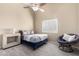 Inviting bedroom featuring a ceiling fan, shuttered windows, and plush carpeting at 30645 N 44Th St, Cave Creek, AZ 85331
