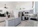 Open-concept kitchen with stainless steel appliances and eat-in island at 30645 N 44Th St, Cave Creek, AZ 85331