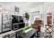 Living room with modern decor, plush seating and a large TV at 30645 N 44Th St, Cave Creek, AZ 85331