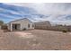 Spacious gravel backyard surrounded by block fencing, offering privacy and low maintenance at 30996 W Osborn Rd, Buckeye, AZ 85396