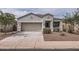 Attractive single-Gathering home with a desert-style front yard and attached garage at 30996 W Osborn Rd, Buckeye, AZ 85396