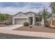 Inviting one-story home with a well-maintained front yard and covered entrance at 30996 W Osborn Rd, Buckeye, AZ 85396