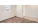 Bright, carpeted living room with a window and a view towards the entrance at 30996 W Osborn Rd, Buckeye, AZ 85396