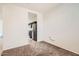 Neutral living room with access to the kitchen featuring stainless steel appliances at 30996 W Osborn Rd, Buckeye, AZ 85396