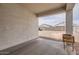 Covered patio overlooking a spacious gravel backyard, ideal for outdoor relaxation and entertaining at 30996 W Osborn Rd, Buckeye, AZ 85396