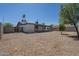 The backyard features low-maintenance landscaping, block wall, and offers plenty of space at 3208 N El Dorado Dr, Chandler, AZ 85224