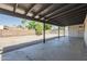 The covered patio overlooks the low-maintenance gravel backyard and block wall at 3208 N El Dorado Dr, Chandler, AZ 85224