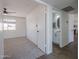 Bedroom showing open door to modern bathroom and view into a living room at 3208 N El Dorado Dr, Chandler, AZ 85224