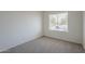 A bright bedroom with a large window and neutral carpet at 3208 N El Dorado Dr, Chandler, AZ 85224