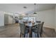 Open-concept kitchen and dining area with wood-look tile flooring, with access to back yard at 3208 N El Dorado Dr, Chandler, AZ 85224