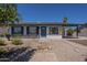 Inviting single-story home with desert landscaping and covered parking at 3208 N El Dorado Dr, Chandler, AZ 85224