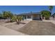 Charming single-story home features desert landscaping, large driveway and inviting entryway at 3208 N El Dorado Dr, Chandler, AZ 85224