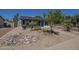Single-story home with xeriscaping featuring decorative rocks and mature landscaping at 3208 N El Dorado Dr, Chandler, AZ 85224