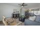 Spacious living room featuring wood-look floors, natural light, and an open layout at 3208 N El Dorado Dr, Chandler, AZ 85224