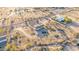 Desert community with sparse foliage and one-story ranch homes at 3349 N Ralston Rd, Maricopa, AZ 85139