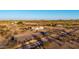 Overhead view of a cozy desert home, featuring ample space and a car at 3349 N Ralston Rd, Maricopa, AZ 85139