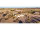 Nestled among sparse desert landscaping, this one-story house has a large lot at 3349 N Ralston Rd, Maricopa, AZ 85139
