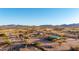 Captured is a beautiful desert homes with long dirt roads and distant mountains at 3349 N Ralston Rd, Maricopa, AZ 85139