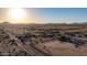 Wide aerial shot showcases desert homes under a clear sky with distant mountains at 3349 N Ralston Rd, Maricopa, AZ 85139