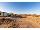 Expansive backyard with desert landscaping shows the peaceful and serene atmosphere at 3349 N Ralston Rd, Maricopa, AZ 85139