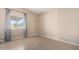 Small bedroom with tile flooring, a window with curtains, and neutral paint at 3349 N Ralston Rd, Maricopa, AZ 85139