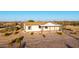 Charming single-story home with a large front porch and desert landscaping at 3349 N Ralston Rd, Maricopa, AZ 85139