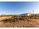 Exterior view of the home with desert landscaping, showing the wide-open space at 3349 N Ralston Rd, Maricopa, AZ 85139