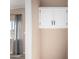 Hallway view of a window with neutral paint and wood-look vinyl flooring at 3349 N Ralston Rd, Maricopa, AZ 85139