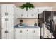 Cozy kitchen featuring white cabinets, blue countertops, coffee station, and modern appliances at 3349 N Ralston Rd, Maricopa, AZ 85139