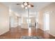 Spacious living room features an open floor plan, hardwood floors, neutral walls, and a ceiling fan at 3349 N Ralston Rd, Maricopa, AZ 85139