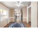 View of living area leading to kitchen with hardwood floors and neutral paint at 3349 N Ralston Rd, Maricopa, AZ 85139