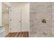 Renovated bathroom featuring a tiled shower, sleek fixtures, and granite counters at 3441 E Taylor St, Phoenix, AZ 85008
