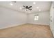 Neutral carpeted bedroom with ceiling fan, recessed lighting, and a bright window at 3441 E Taylor St, Phoenix, AZ 85008