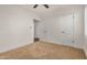 Bright bedroom with neutral carpet, ceiling fan, and white trim at 3441 E Taylor St, Phoenix, AZ 85008