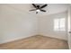 Bedroom featuring neutral carpet, a ceiling fan, and a window at 3441 E Taylor St, Phoenix, AZ 85008