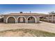 Charming home exterior features arched entryways, a covered carport, and a spacious front yard at 3441 E Taylor St, Phoenix, AZ 85008