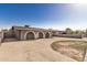 Charming home exterior features arched entryways, a covered carport, and a spacious front yard at 3441 E Taylor St, Phoenix, AZ 85008