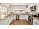 Updated kitchen with stainless steel appliances, granite counters and bright cabinets at 3441 E Taylor St, Phoenix, AZ 85008